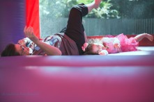 girl and lady laughing in bounce castle